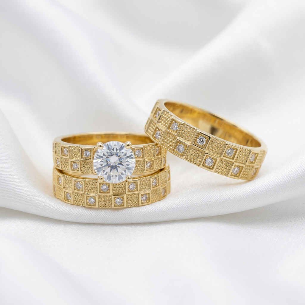 Three-piece matching bridal ring set with one men's band and two women's rings on white satin