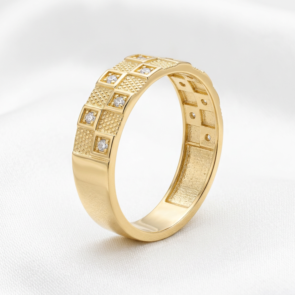Yellow gold patterned band from the 10kt gold wedding trio set on white satin